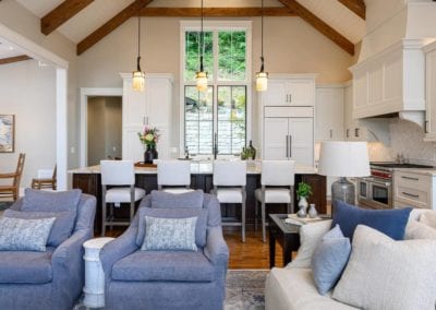 Living room seating with kitchen in background